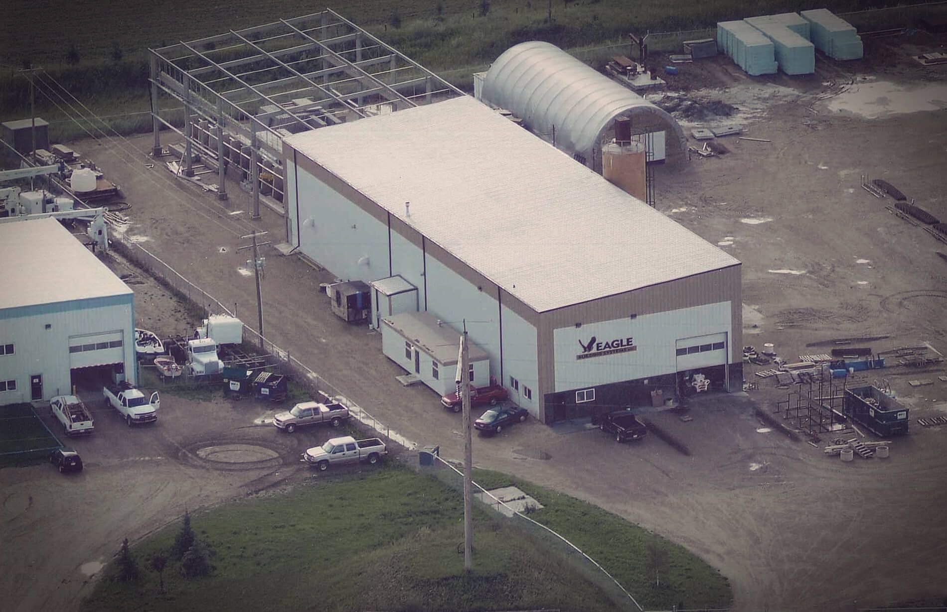 Exterior view of an Eagle Builders facility on a sunny day