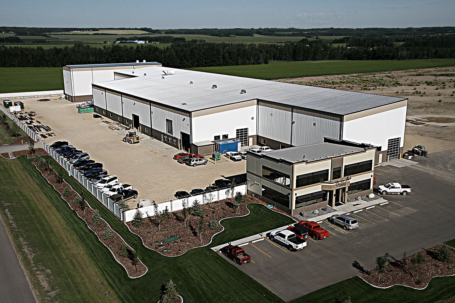 Exterior view of an Eagle Builders facility on a sunny day