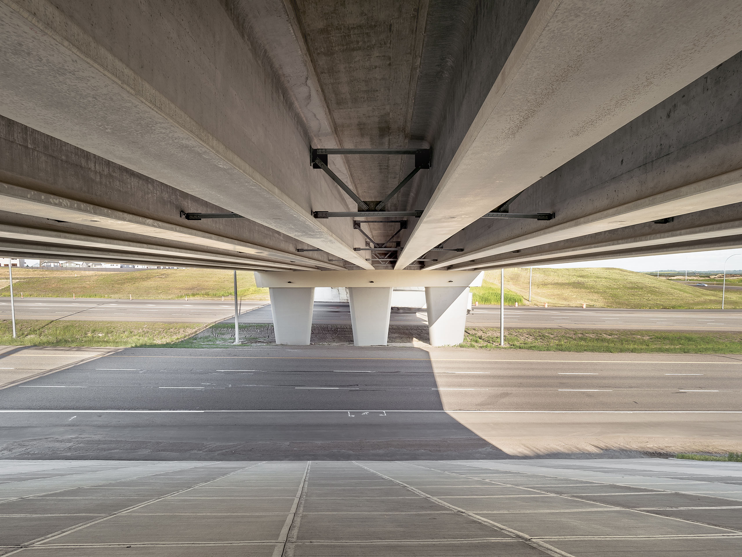 View from the underside of an overpass on a sunny day