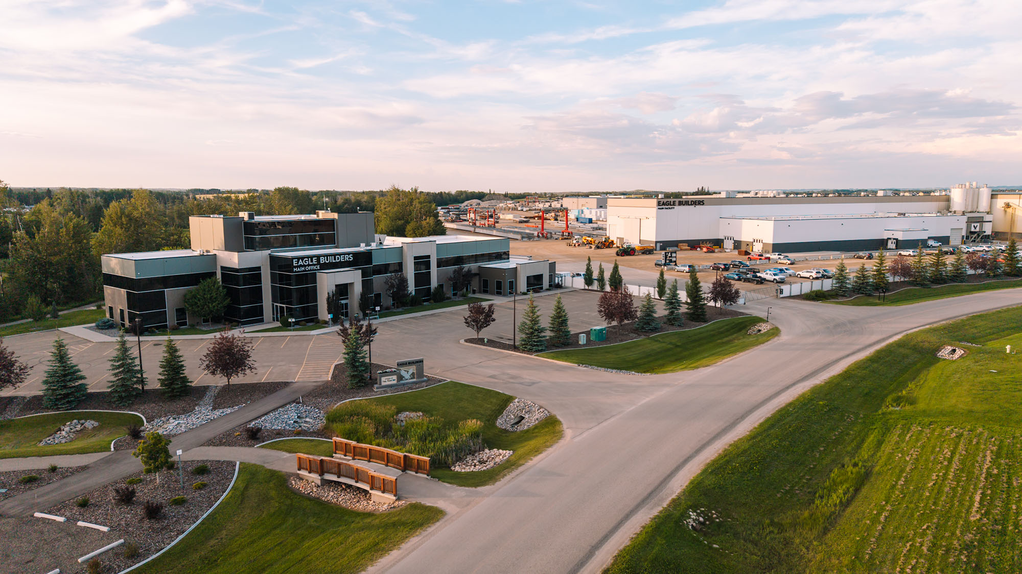 Exterior view of the Eagle Builders main office, along with one of the facilities on a sunny day