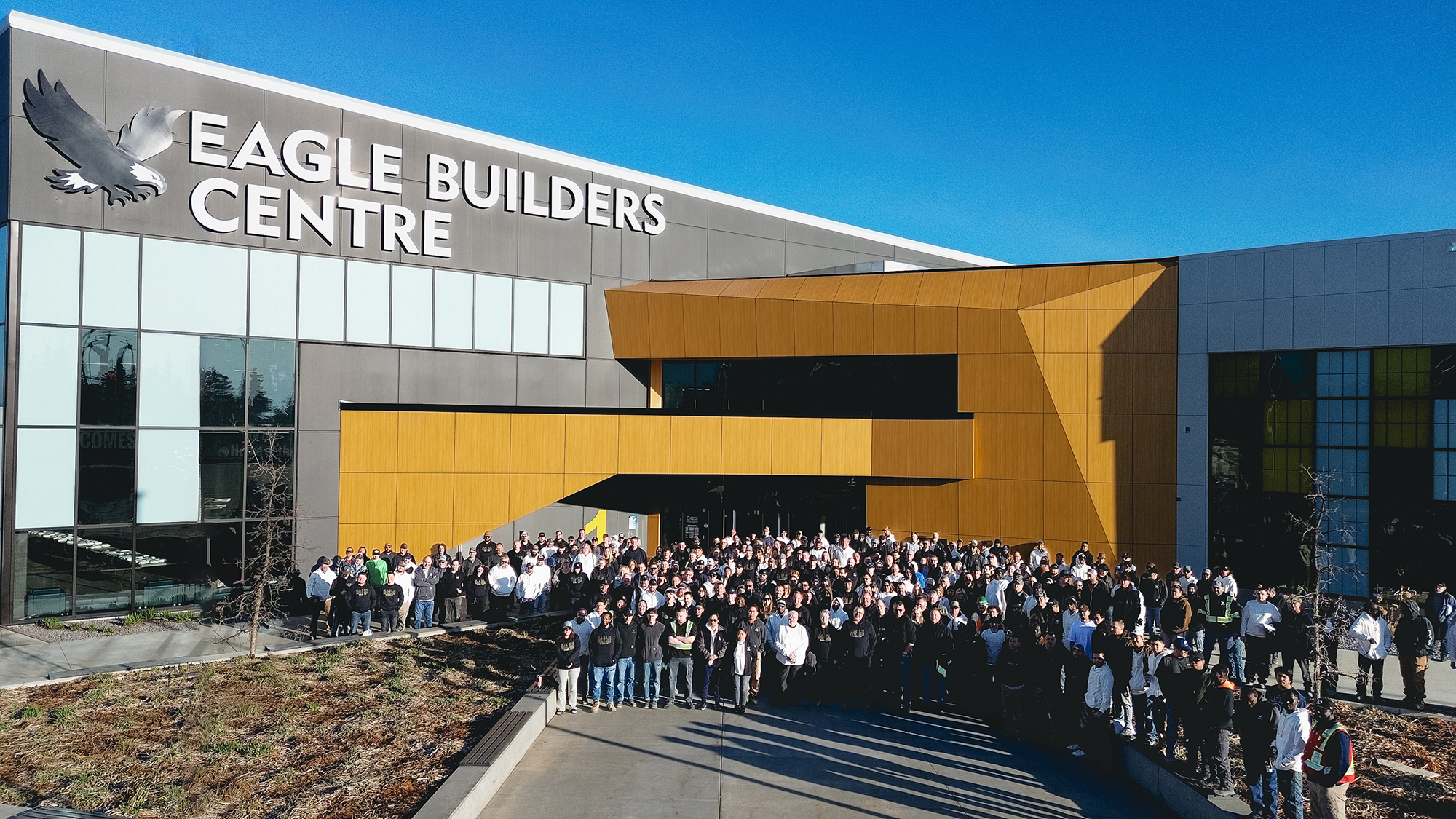The team at the Eagle Builders Centre on a sunny day, looking at the camera