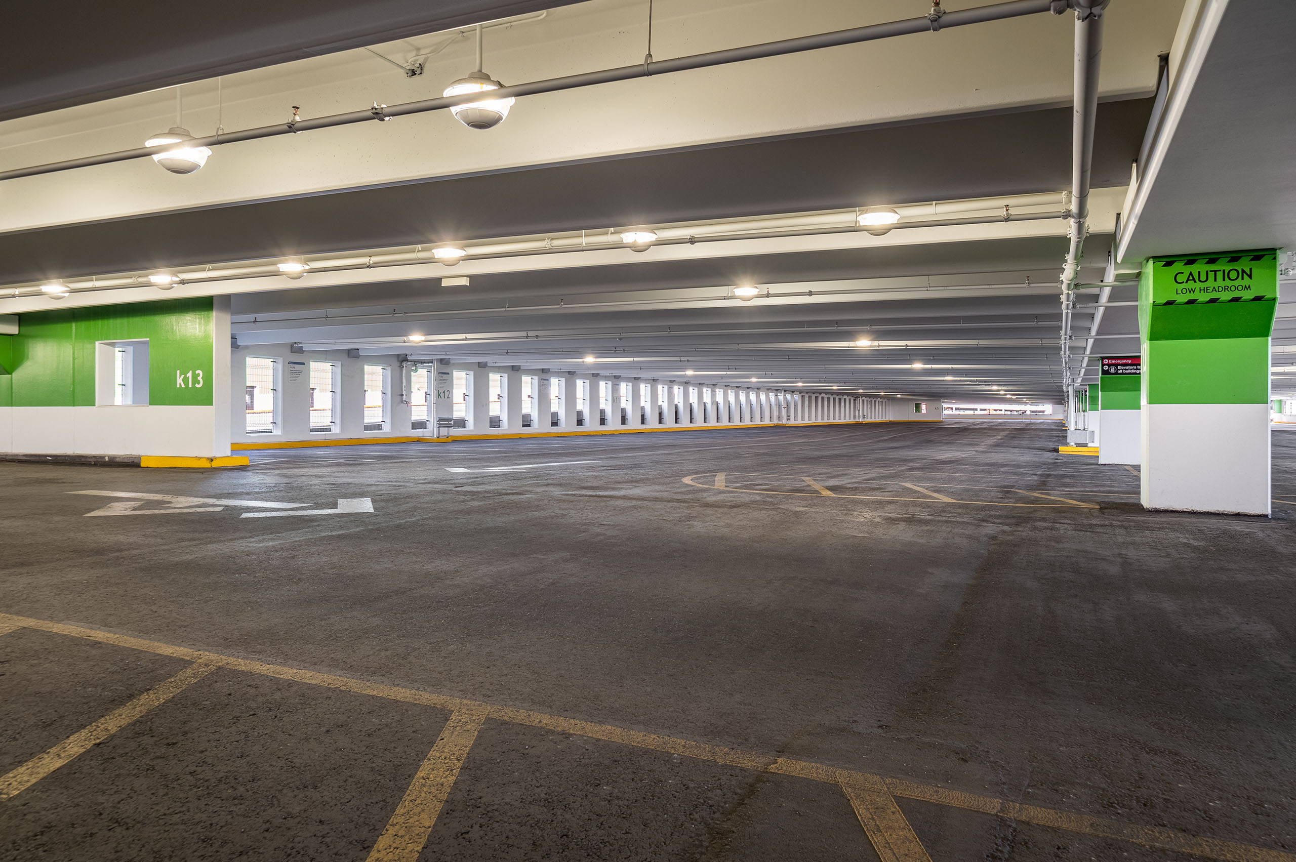 Interior view of the Foothills Medical Centre Parkade with green-accented walls