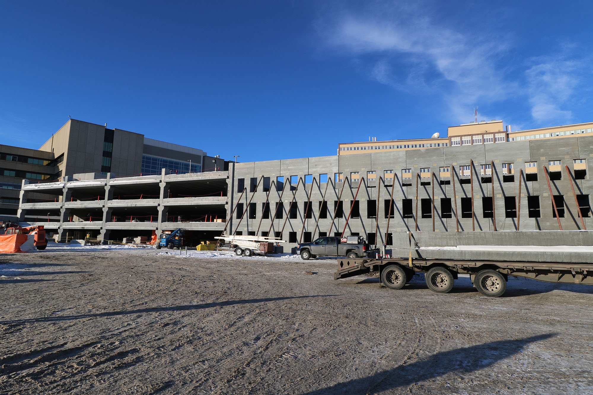 Exterior view of the Foothills Medical Centre Parkade being constructed on a sunny day