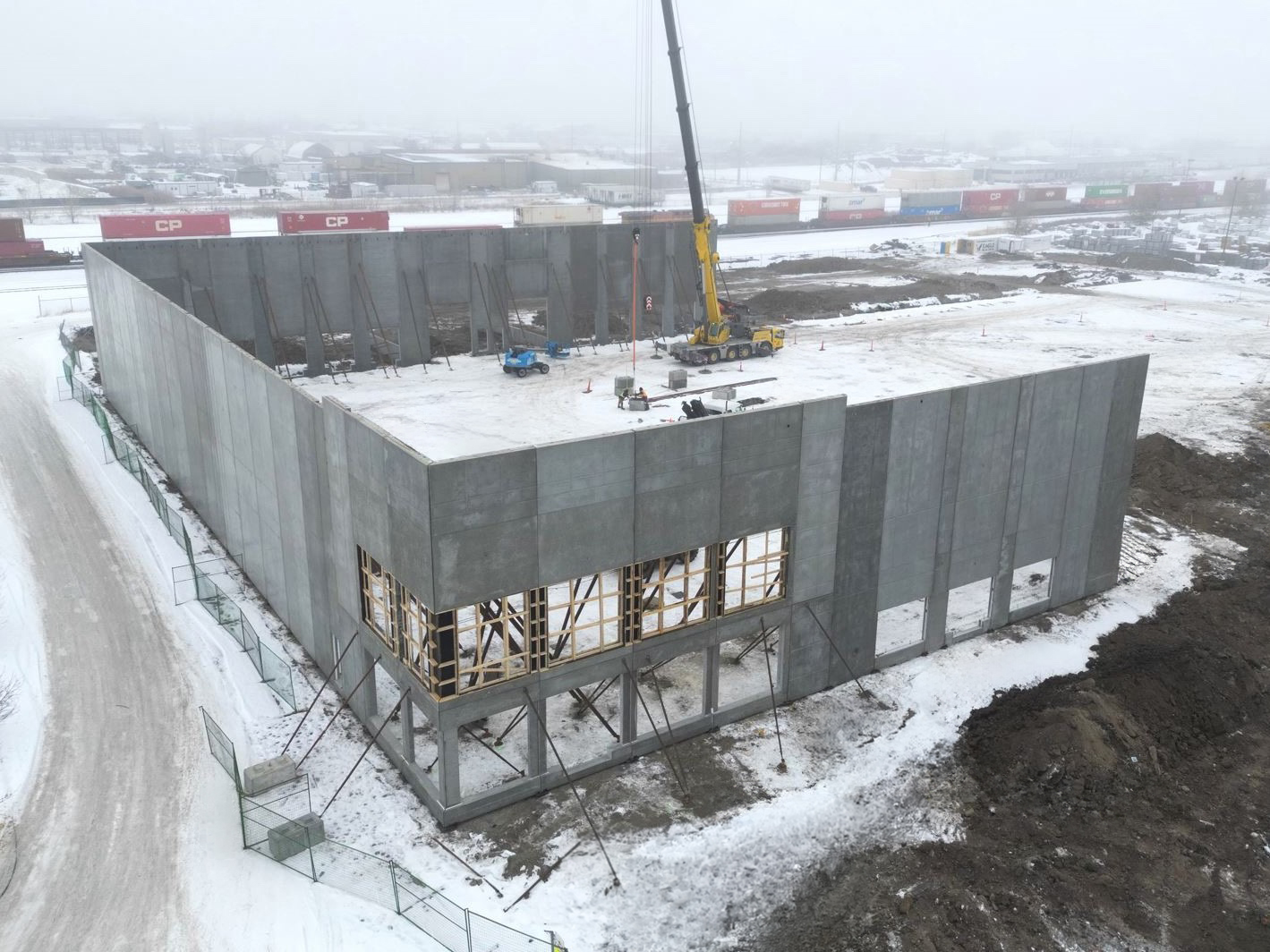 Exterior view of the Nexus building being constructed on a winter day