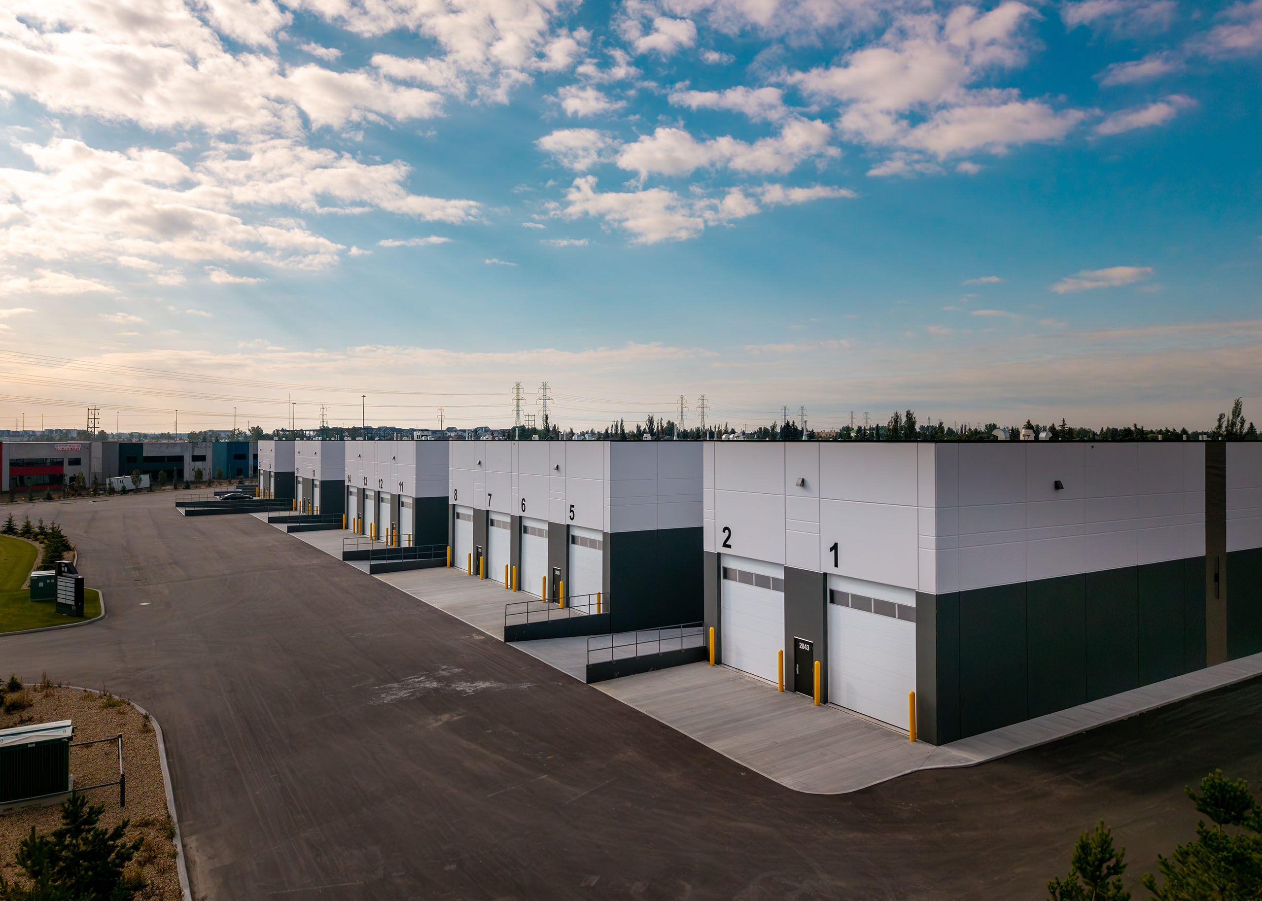 Exterior view of the Whitemud Industrial Condos building on a sunny day