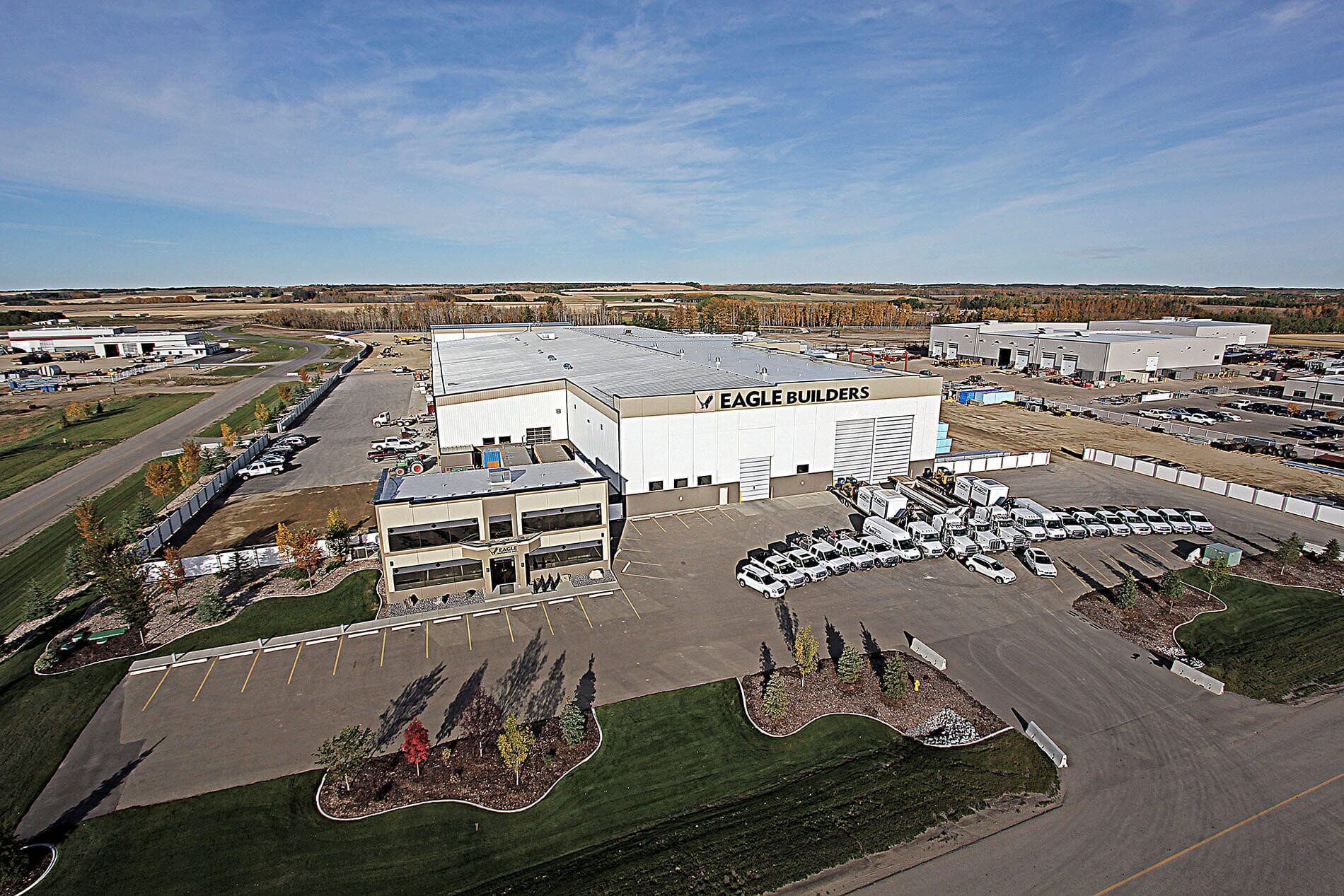 Exterior view of an Eagle Builders facility on a sunny day