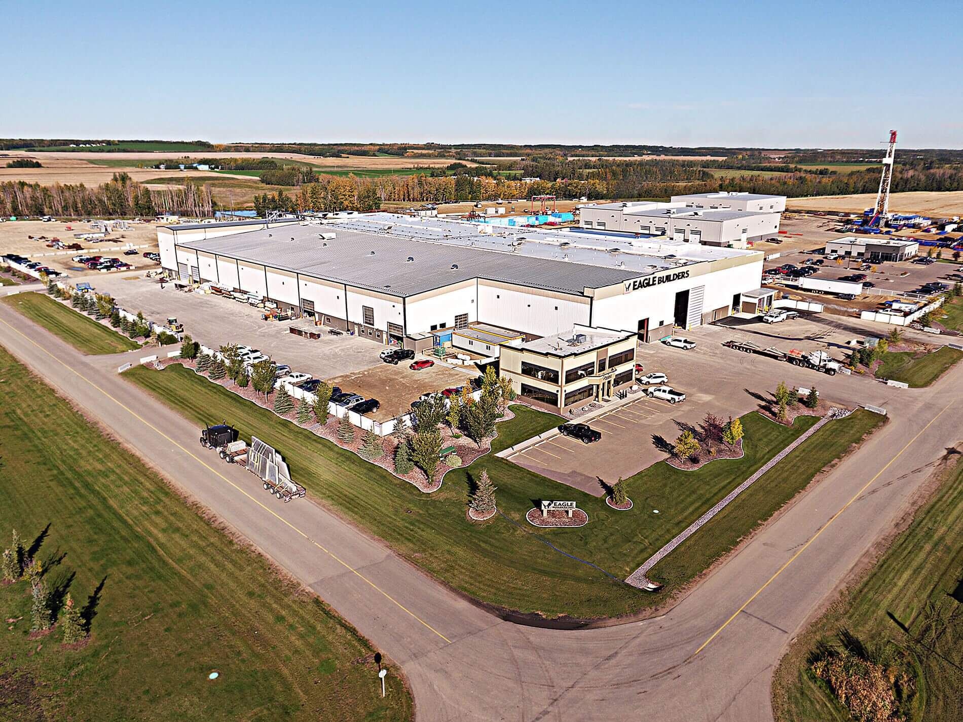 Exterior view of an Eagle Builders facility on a sunny day