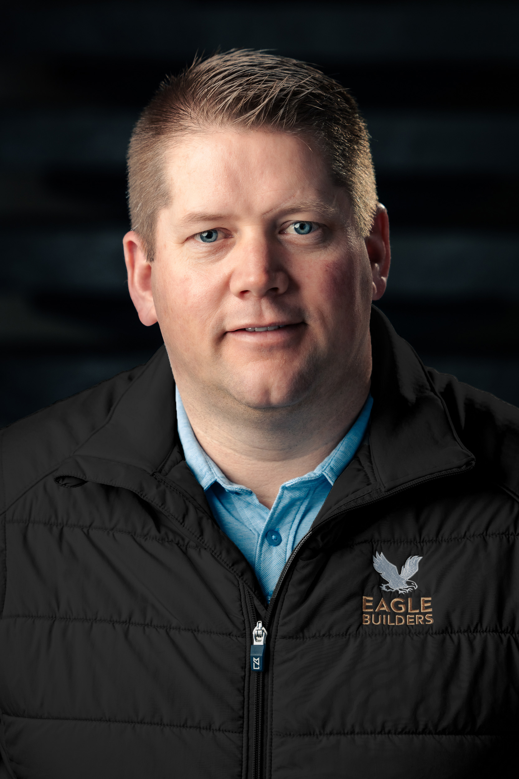 Headshot of Craig Haan, smiling at the camera