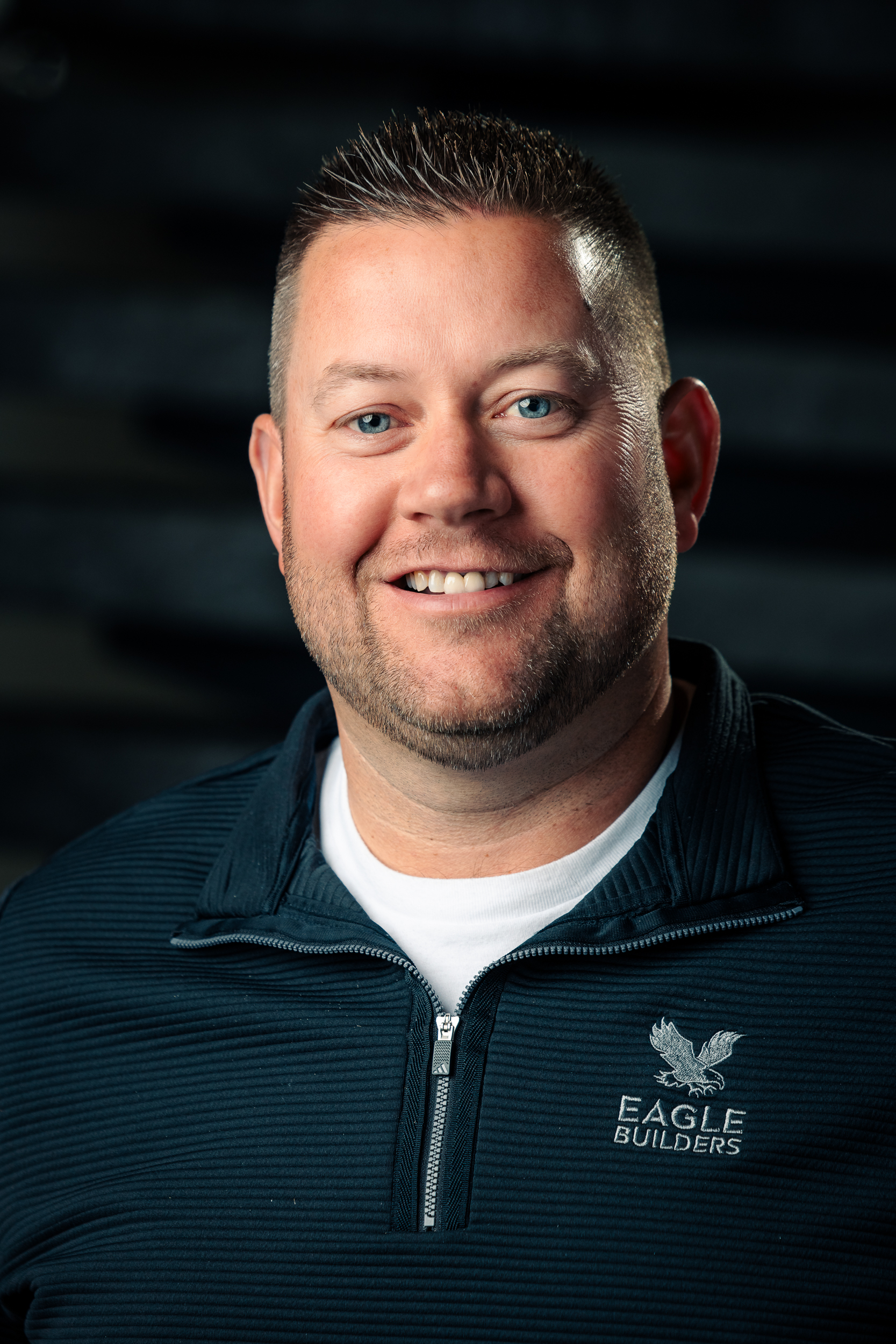 Headshot of Dennis Haan, smiling warmly at the camera