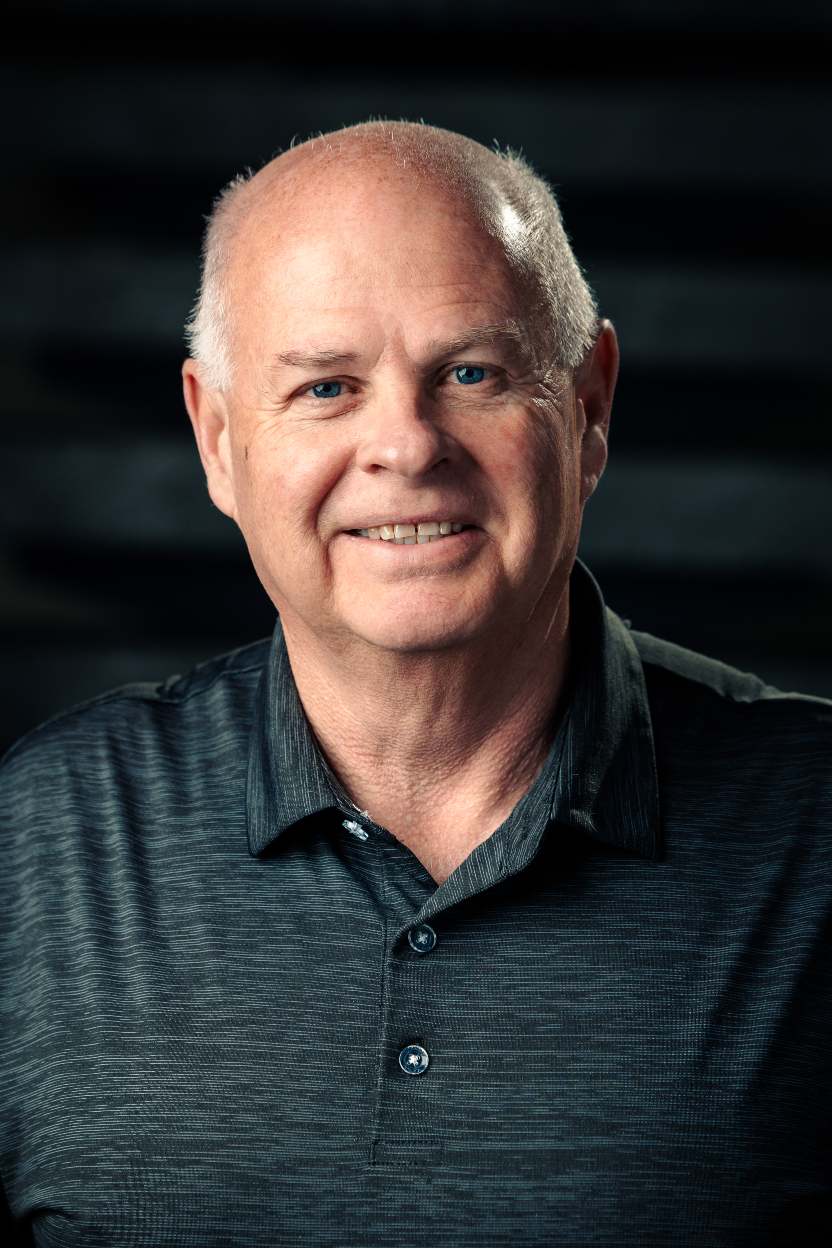 Headshot of Jerry Van Someren, smiling warmly at the camera