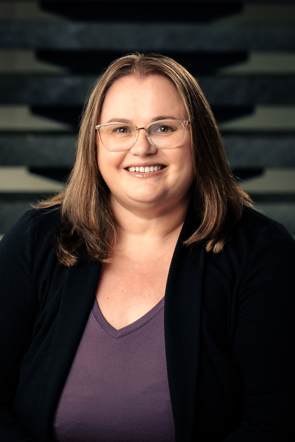 Headshot of Karen Dilon, smiling warmly at the camera
