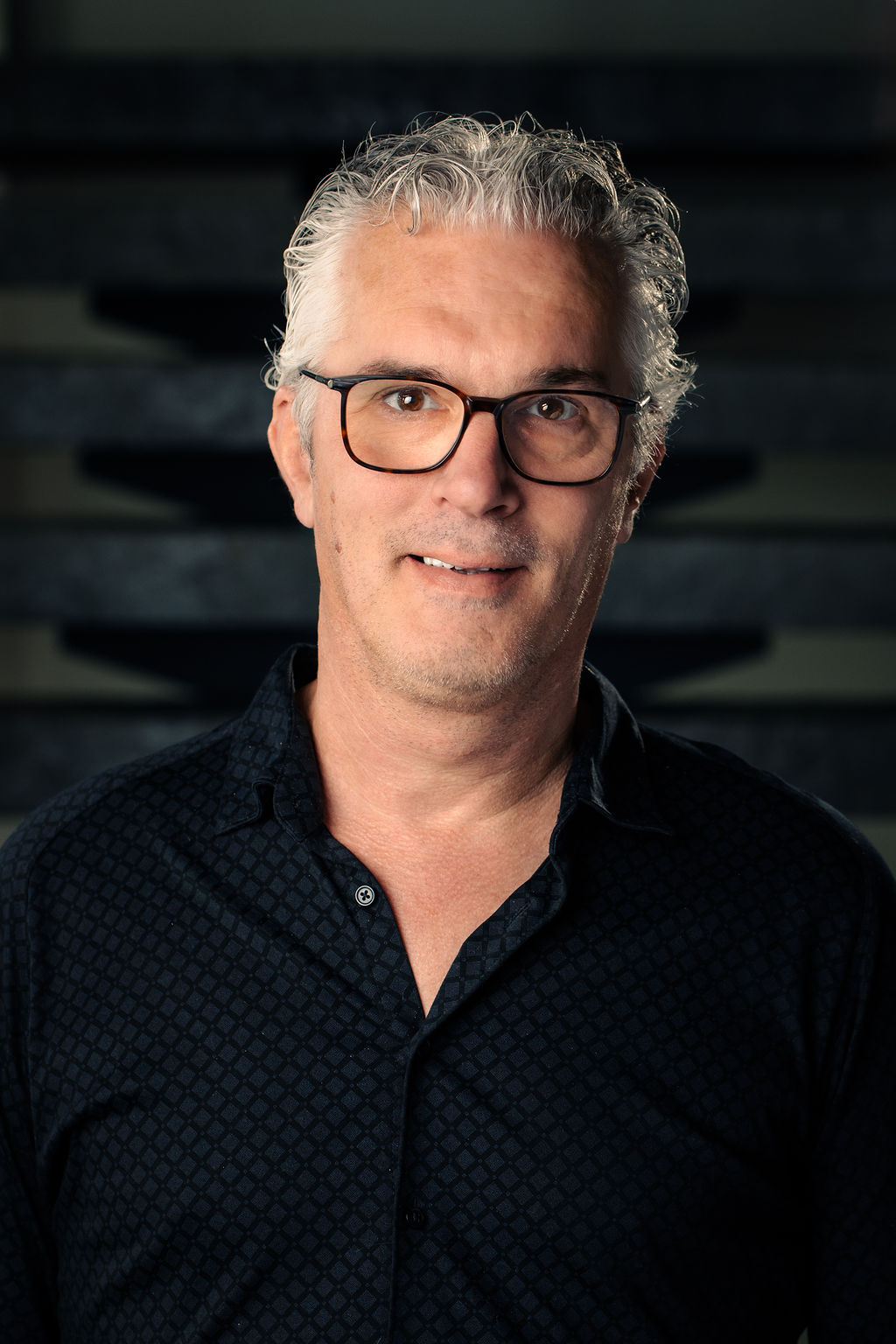 Headshot of Niels Goedhart, smiling warmly at the camera
