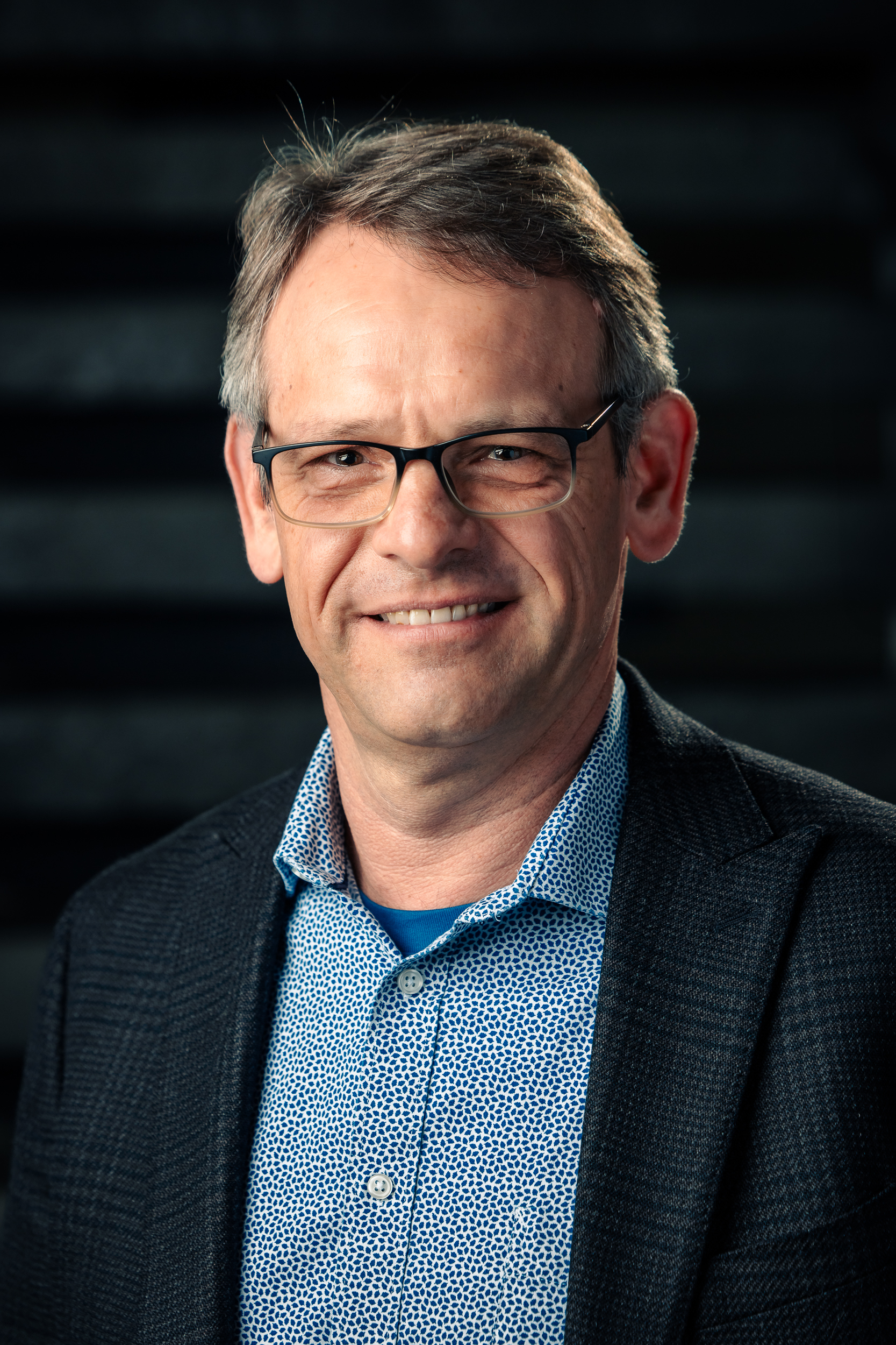 Headshot of Werner Brouwer, smiling warmly at the camera